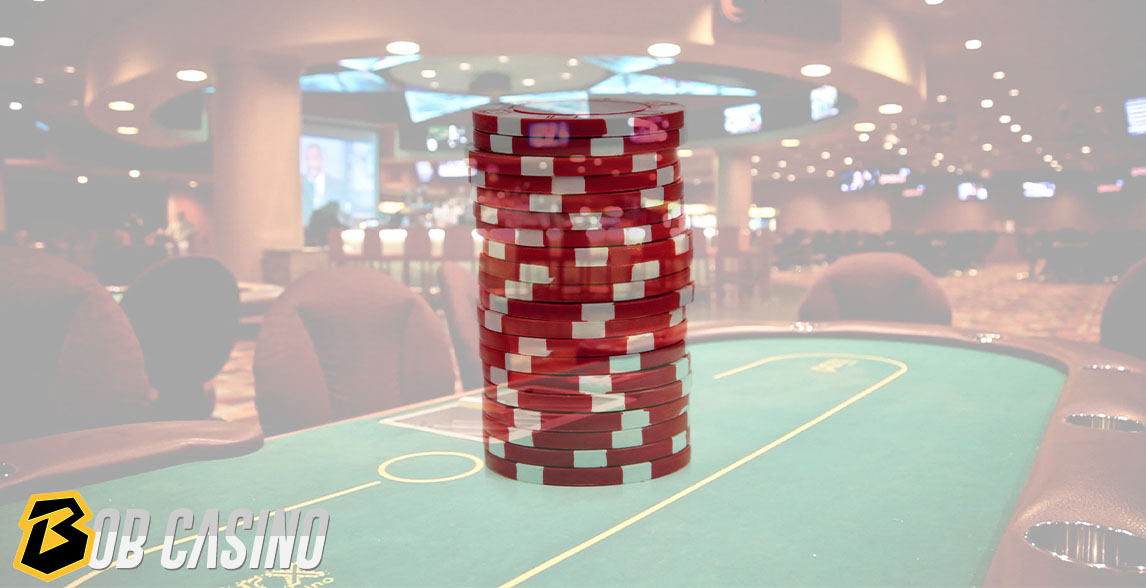 Twenty Red Chips in Stack on the Poker Table