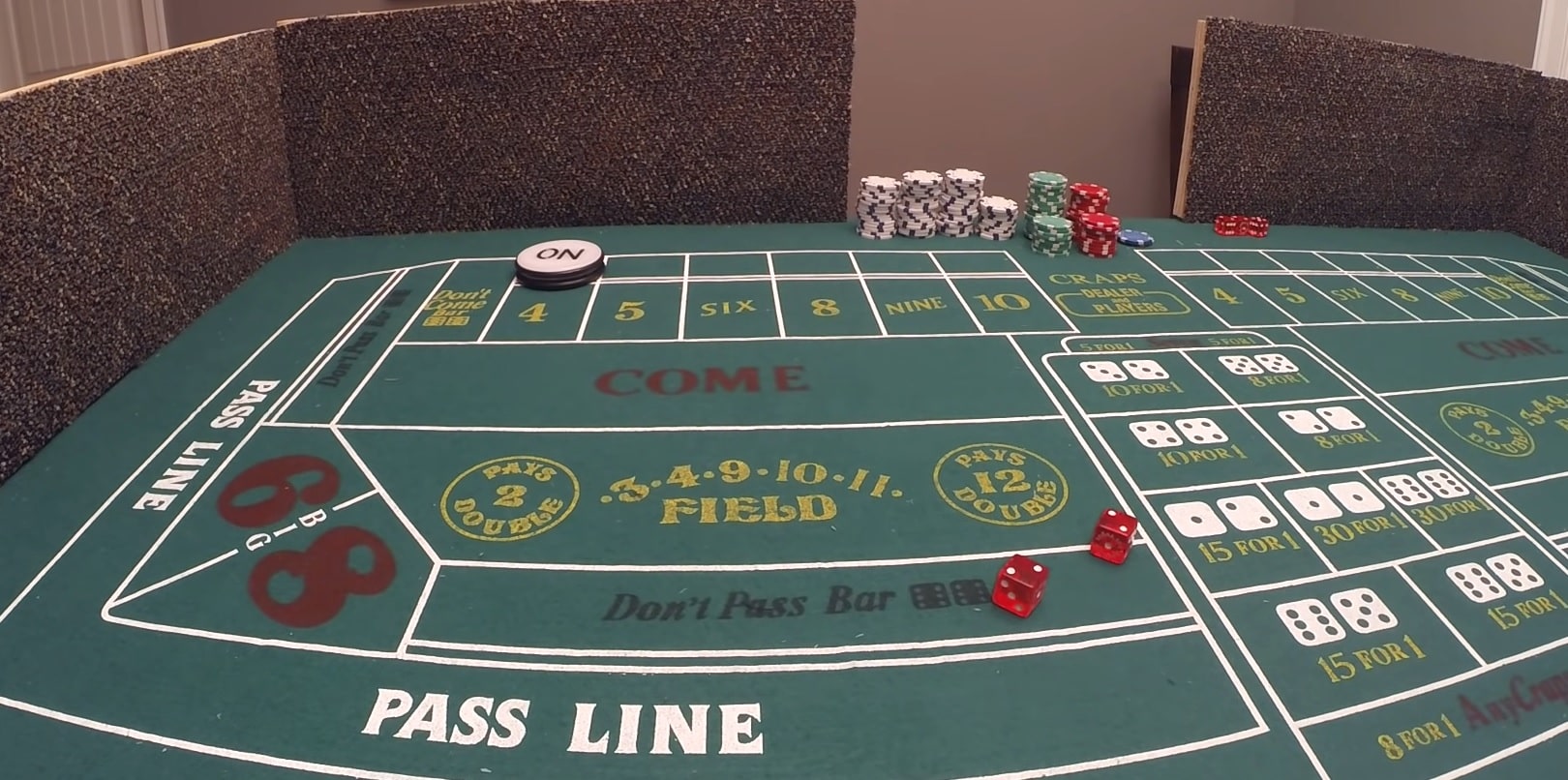 A a green craps table with the ON button placed on 4, establishing it as the point. 