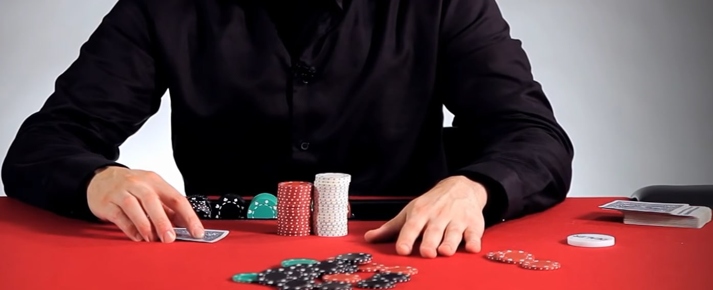 A Texas Hold'em player sitting behind the rounds pot of chips