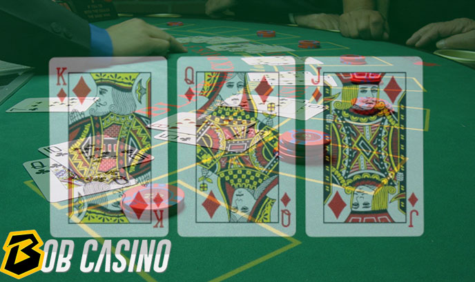 Jacks, Queens, and Kings cards Facing up on casino table