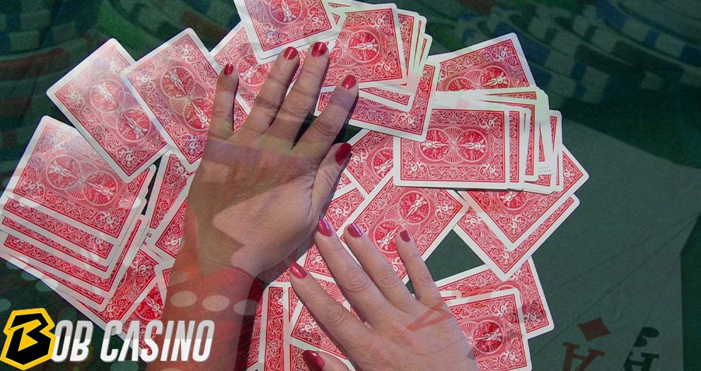 Woman Shuffling Cards on the poker table