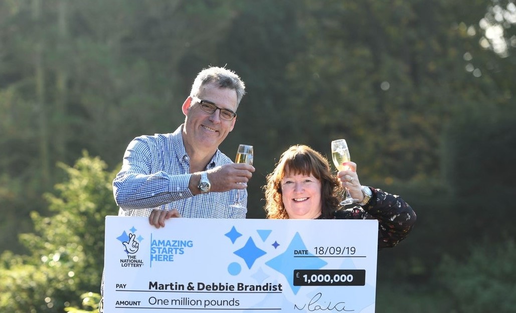 The Brandist couple with their £1 million lottery win after 25 years of using the same numbers.