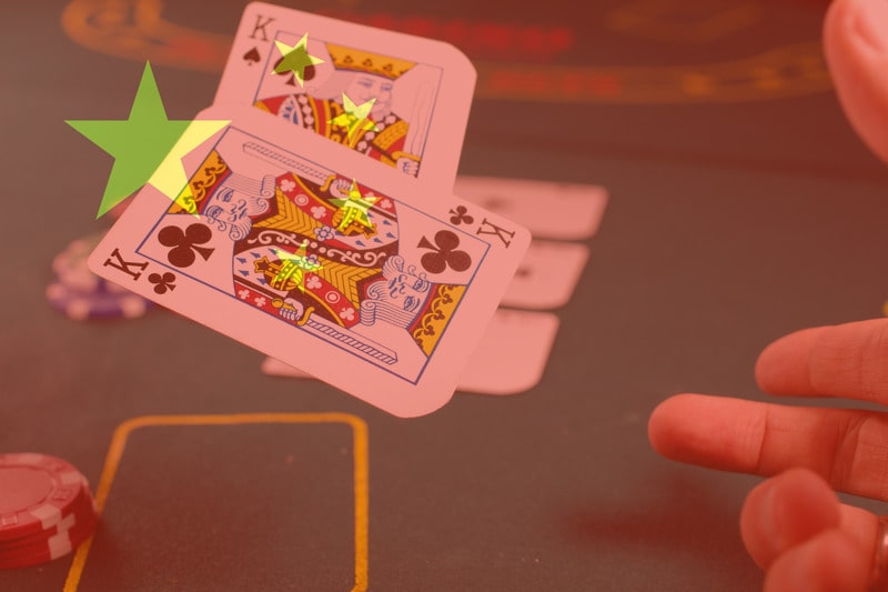 China's flag over the casino table, indicating their continued fight against illegal gambling in 2020.