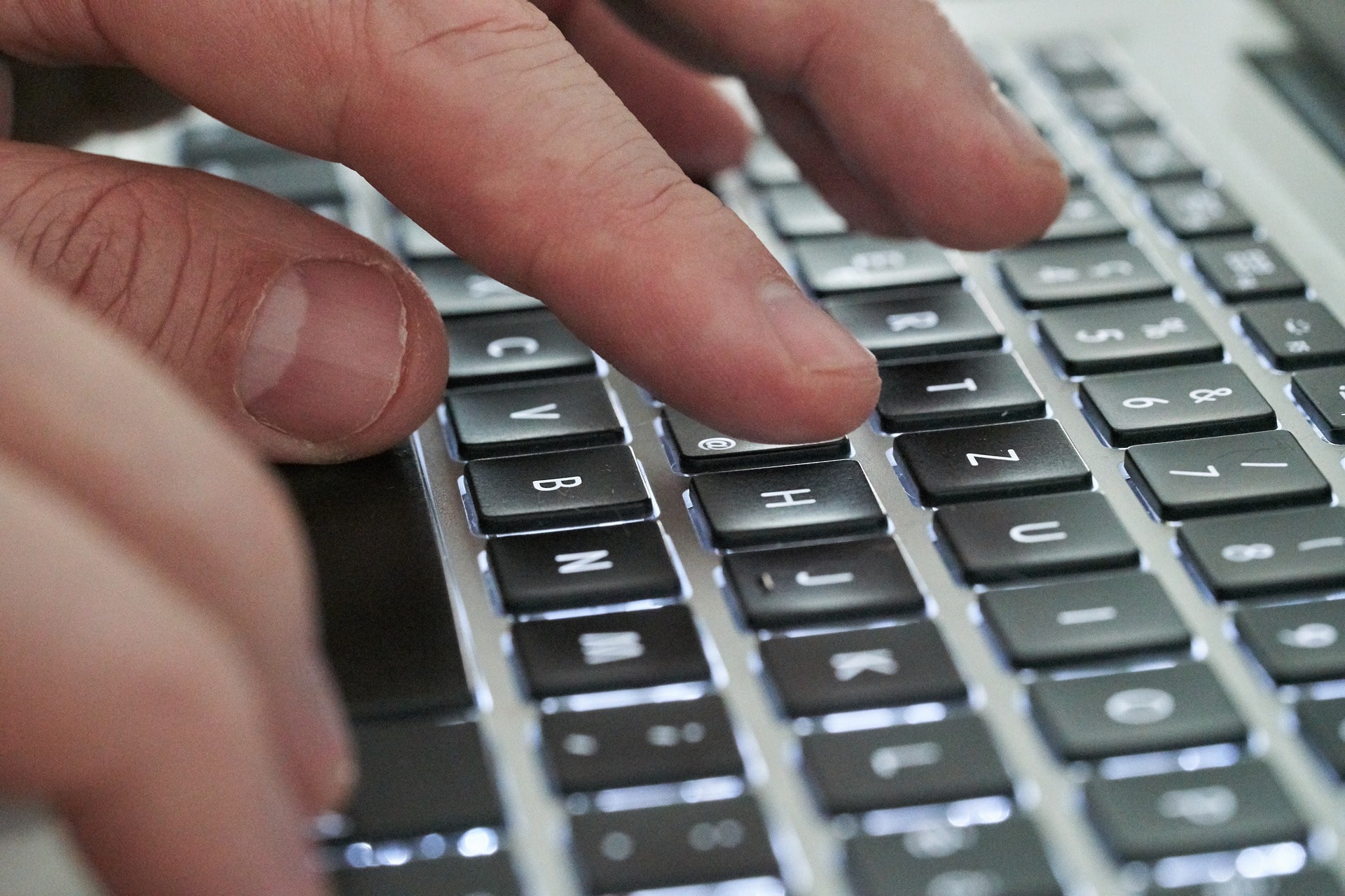 Fingers typing on a keyboard, resembling the tech startups entering the sports betting market.