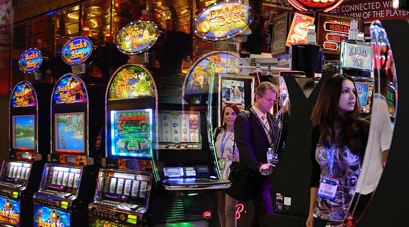 People playing video slot machines in a casino